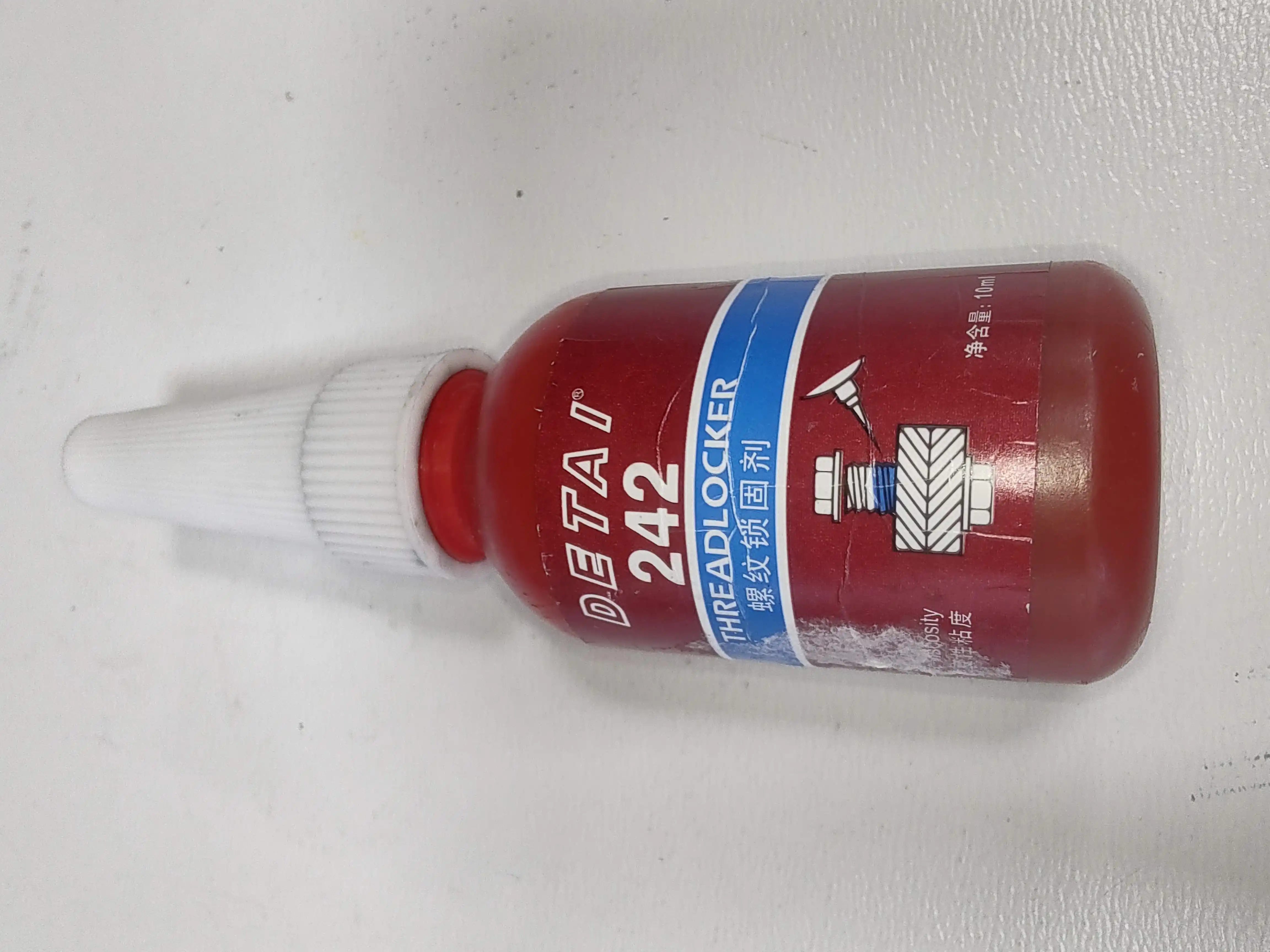 Detai 242: Skrivnost Zanesljivega Delovanja Strojev, Detai 242, thread locker glue, Loctite 222, anaerobno lepilo, navoji, strojegradnja, industrijska avtomatizacija, robotika, embalaža, zanesljivost, konkurenčna cena, ergonomično, vzdrževanje, aplikacija, kakovost, podjetje Svet črnil, Slovenija