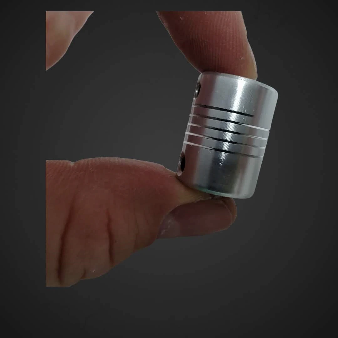 Gibljiva Spojka D19L25 za pogonsko gred ID 5mm OD 8mm, D19L25,coupler,motor,gred,osovina,popravilo,ceneje, ugodno, prihranek, lokalno, ljubljana, gibljiva spojka D19L25, spojka za pogonsko gred, CNC spojka, GRBL arduino, 3D tiskalnik sklopka, laserski gravirnik spojka