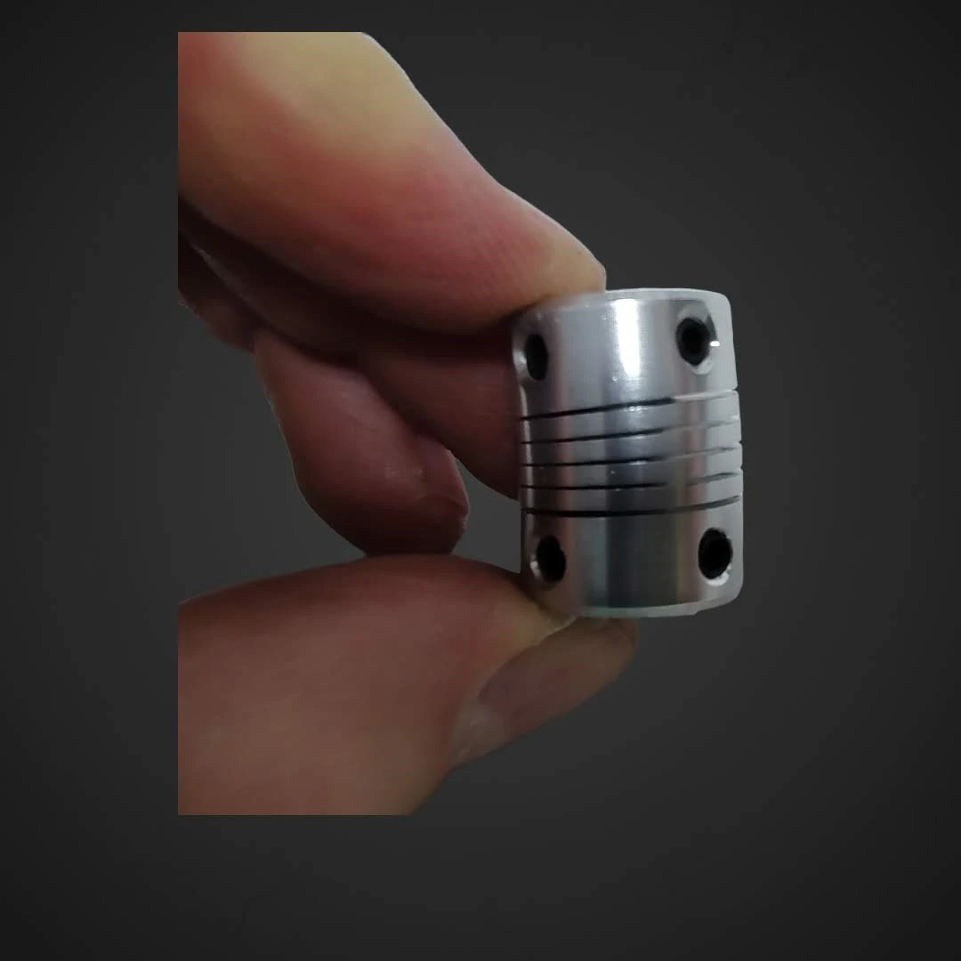 Gibljiva Spojka D19L25 za pogonsko gred ID 5mm OD 8mm, D19L25,coupler,motor,gred,osovina,popravilo,ceneje, ugodno, prihranek, lokalno, ljubljana, gibljiva spojka D19L25, spojka za pogonsko gred, CNC spojka, GRBL arduino, 3D tiskalnik sklopka, laserski gravirnik spojka