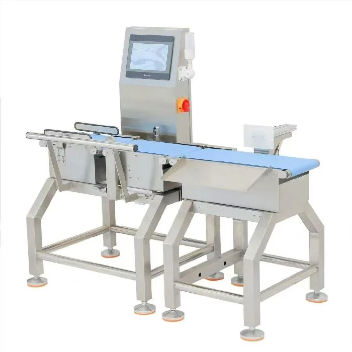 Kako deluje avtomatski kontrolni tehtalnik na tekočem traku?, kontrolni tehtalnik,checkweigher,dinamično tehtanje,tekoči trak,merilna celica,kontrola mase,pnevmatski izmet,OK NOK