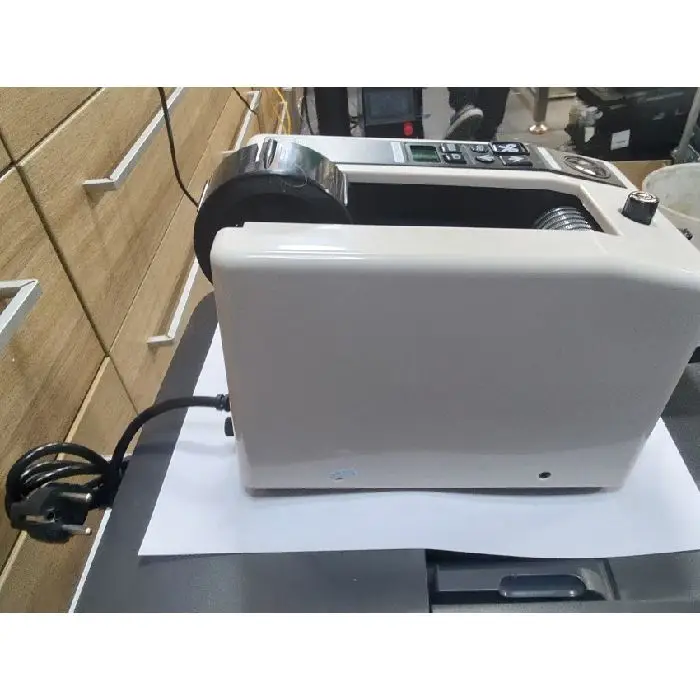 M1000 rezalnik lepilnega traku (selotejpa), M1000, M-1000, rezalnik lepilnega traku, rezalnik selotejpa, elektronski podajalnik traku, pakiranje, spletne trgovine, delavnice, ceneje, ugodno, prihranek, lokalno, Ljubljana